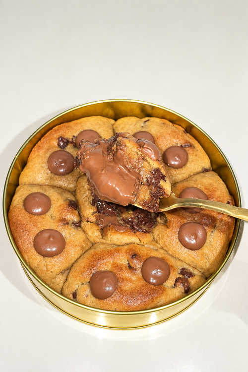 Cookie tin and spoon photo with brighter, warmer lighting